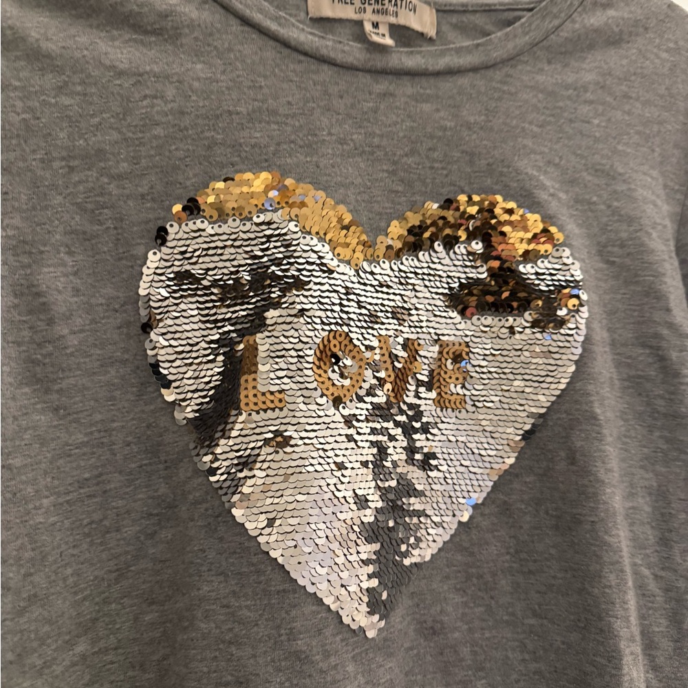 Excellent Condition . Medium but runs small . Love Blingy T shirt . Like New